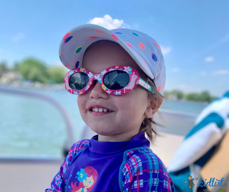 Boat Life, Lake Elizabeth, Wisconsin
child with sunglasses and a hat on, riding in the boat