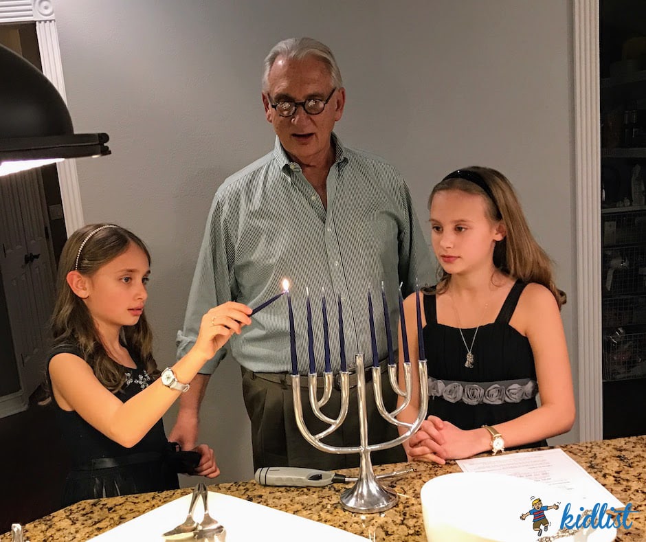 a family starting their Hanukkah events with lighting the menorah