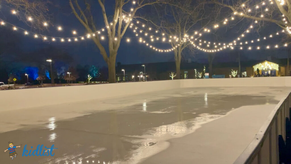ice skating rink at Christmas at Cantigny with lights strung overhead to create a magical ambiance