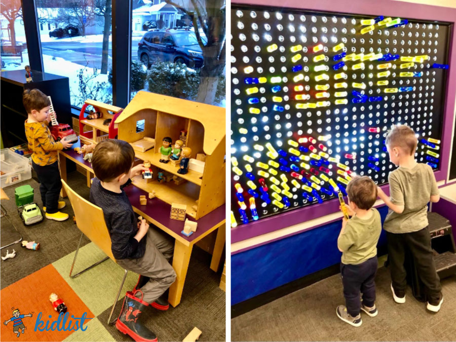 showcasing the best children's libraries, boys are playing in front of a dollhouse and light wall at Downers Grove Library