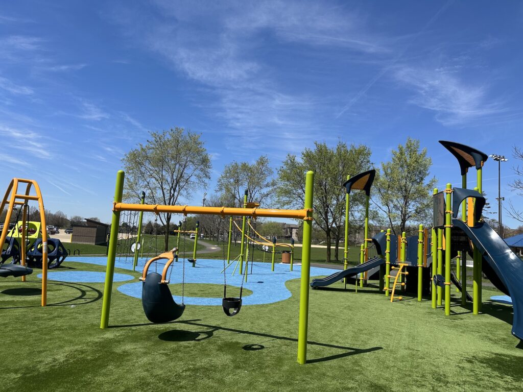Photo of Stratford Park showing adaptive swing and bucket swing.