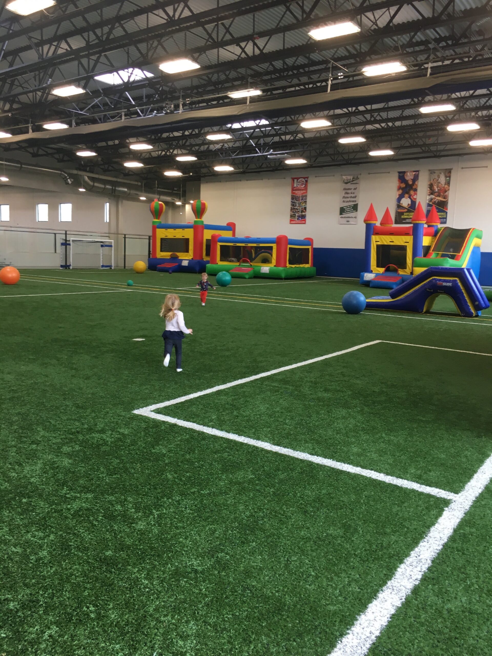 Turf field with inflatables.